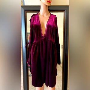 Maroon velvet dress with low v-lined cleavage